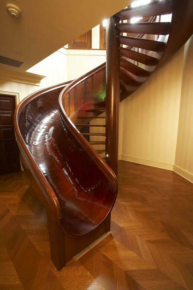 wooden-spiral-staircase-with-slide-beside-it-1